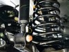 What's the difference between shocks and struts